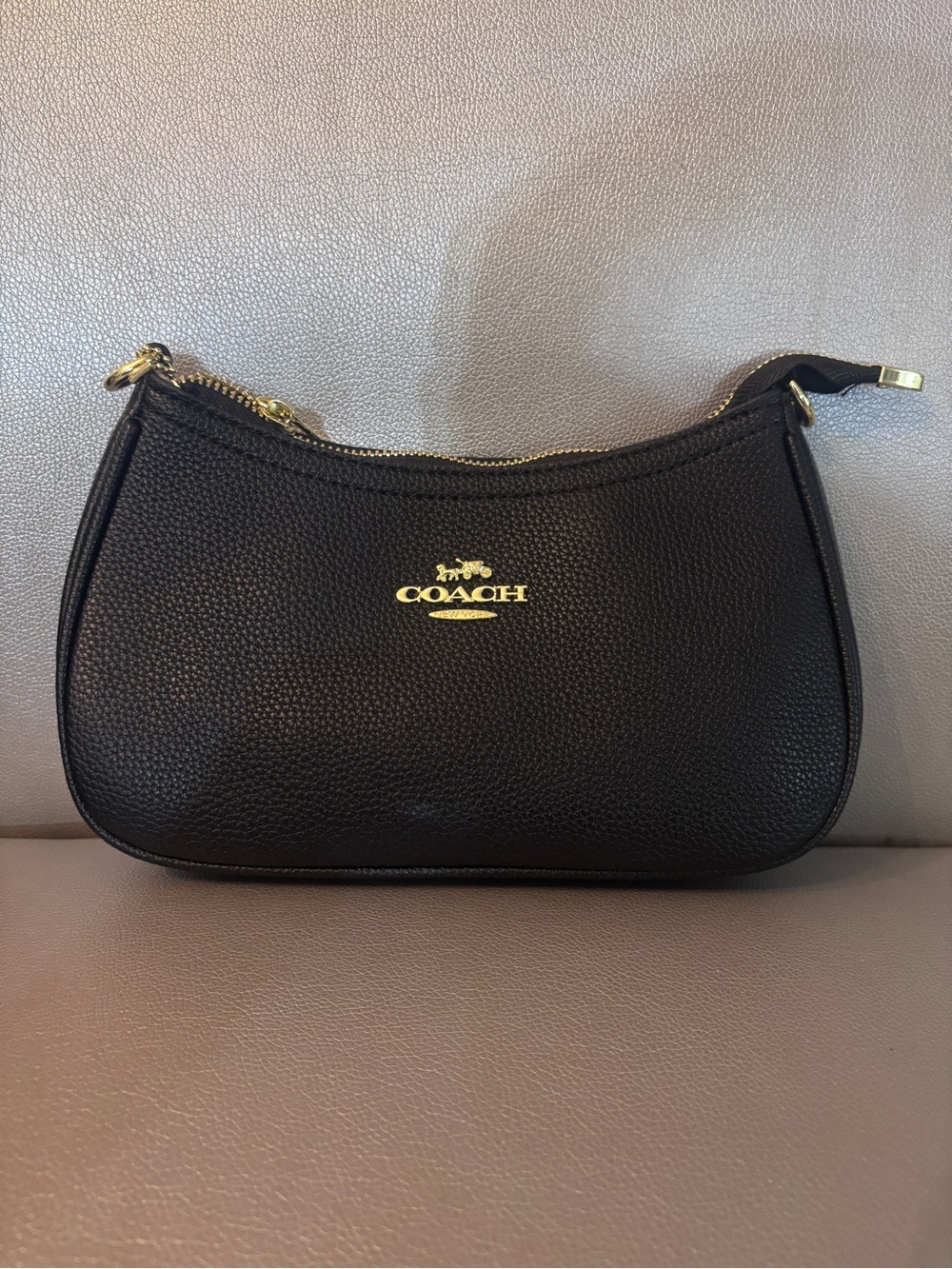Coach Black Leather Shoulder Bag with Gold Hardware.